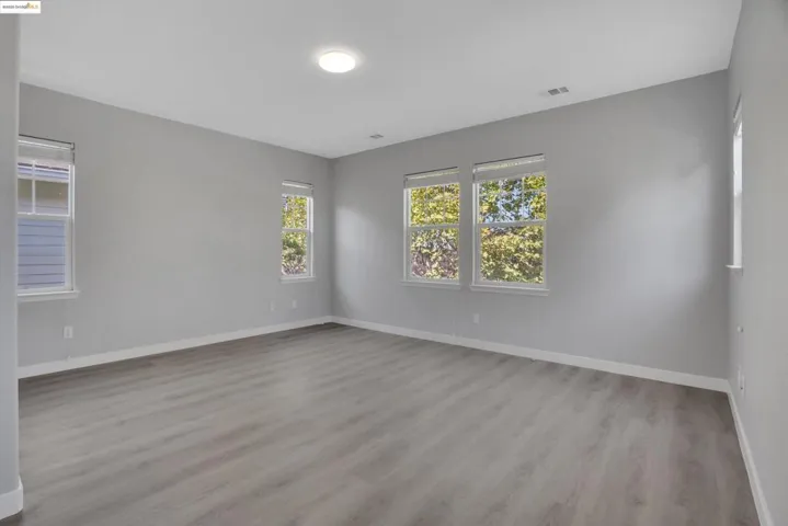 Empty room featuring light wood-type flooring