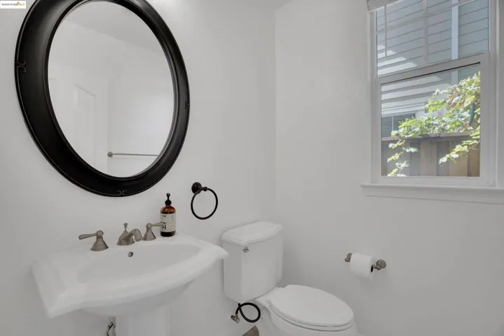 Half bath featuring toilet and a sink