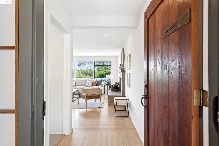 Hallway with light wood-style flooring