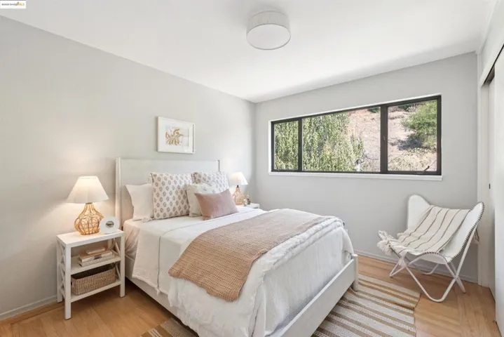 Bedroom featuring light wood-type flooring and a closet