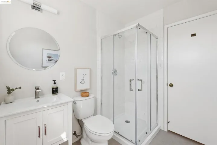 Full bathroom with a shower stall and vanity