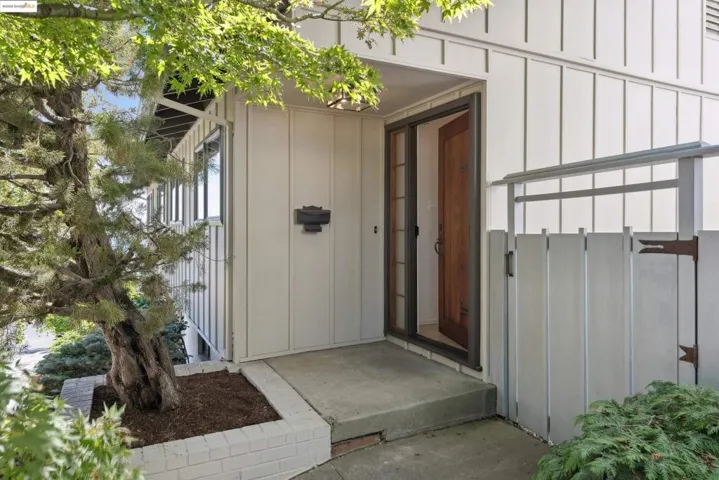 Doorway to property with board and batten siding