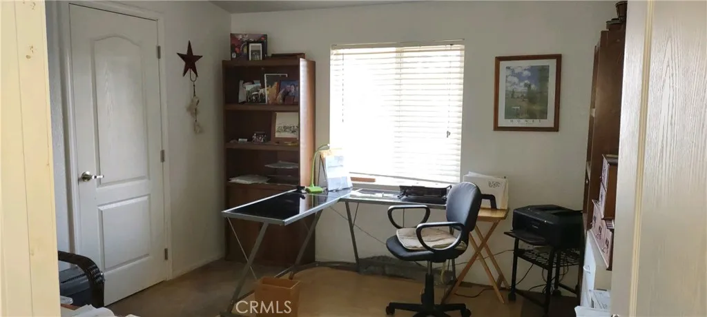 3rd bedroom with walk in closet used as office