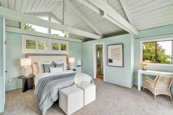 Primary bedroom with vaulted ceilings