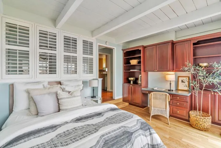 Second bedroom with built-in cabinets and desk