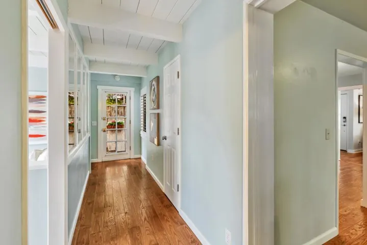 Hallway from main level bathroom, looking at the side door.