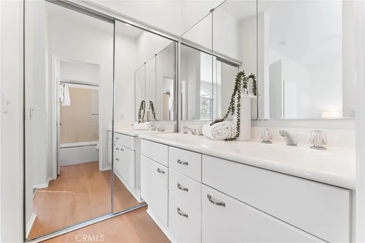 Primary Bath with mirrored wardrobes