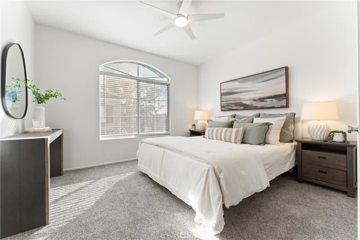 Primary Suite is spacious, features a new ceiling fan and fresh new paint.