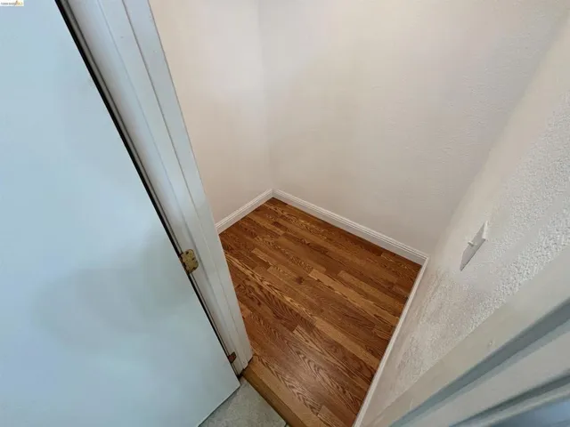 Detailed view of baseboards and wood finished floors