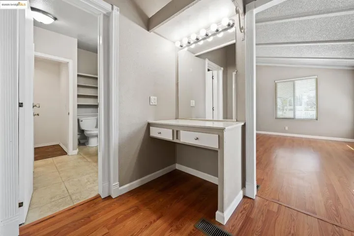 Bathroom featuring wood finished floors and vanity