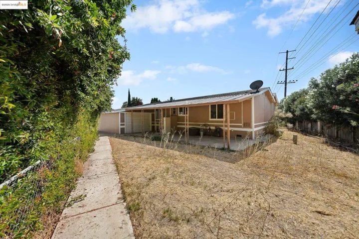 Rear view of property with a patio