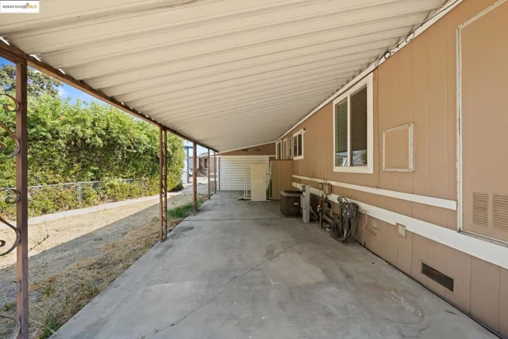 View of patio / terrace featuring a carport