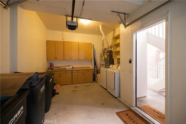 Laundry room and shared storage space.