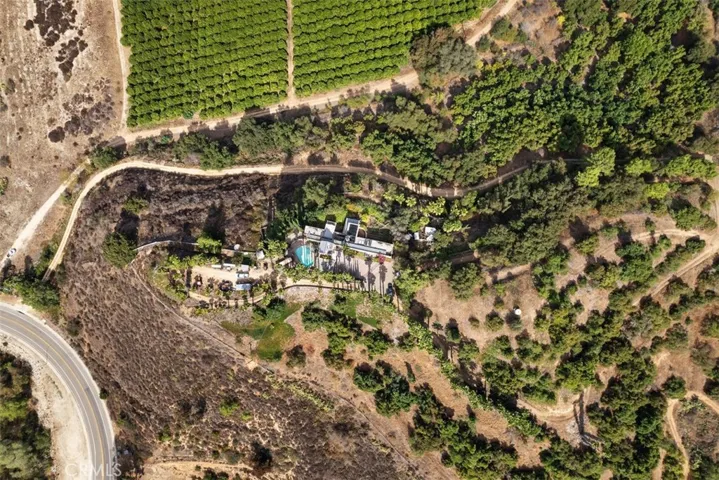 Paved road and long driveway to the estate home