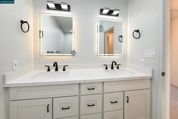 DUAL VANITY WITH WHITE SHAKER CABINETS