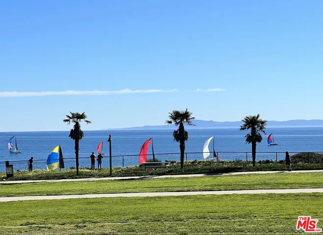 Peaceful Sailboats glide by an