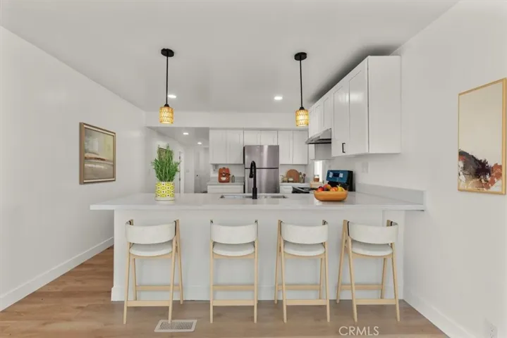 Beautifully and Fully Updated Kitchen Facing Hallway to Bedrooms 15621 Beach Blvd Space 108, Westminster. Photo staged
