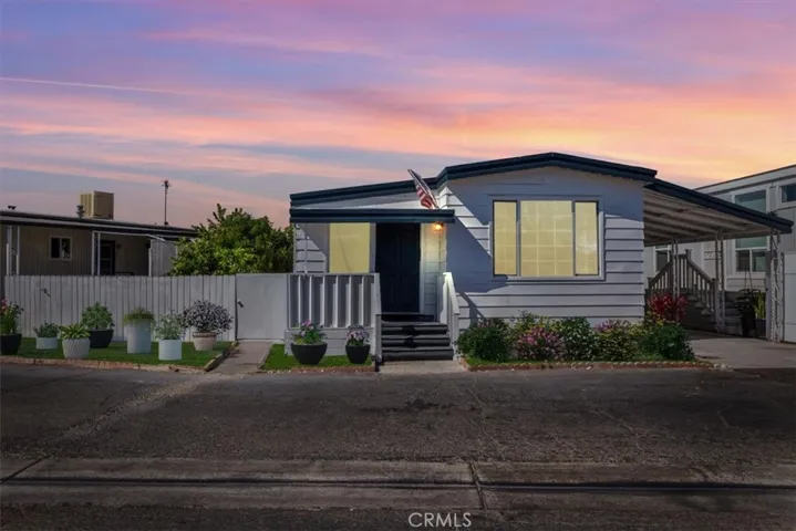 Amazing twilight sunset -of the Front of House 15621 Beach Blvd Space 108, Westminster. Photo is staged