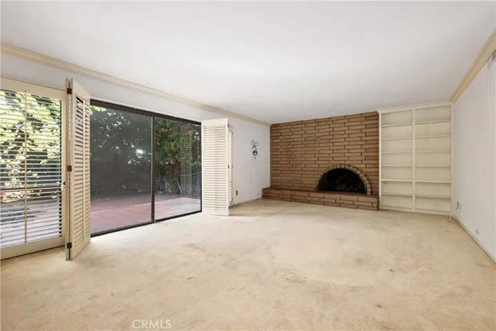 Family room w/fireplace and access to backyard