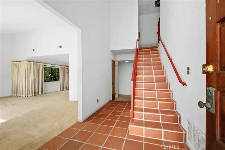 Stairs up and step down formal living room