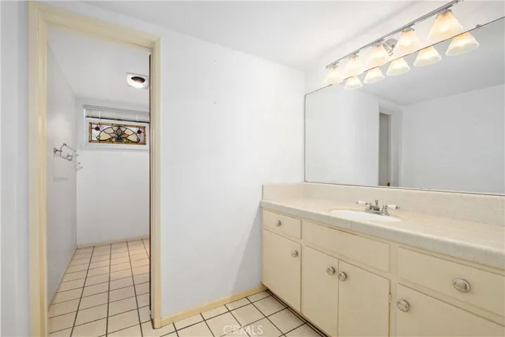 Downstairs full bathroom w/separate shower area.