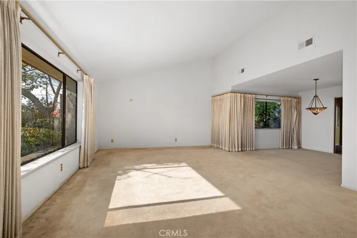 Formal living room w. cathedral ceiling
