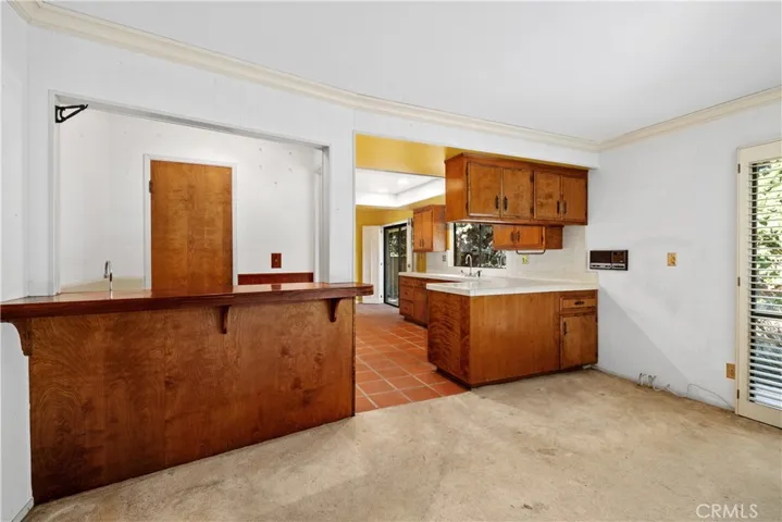 Wet bar in family room and kitchen with a walk-in pantry.