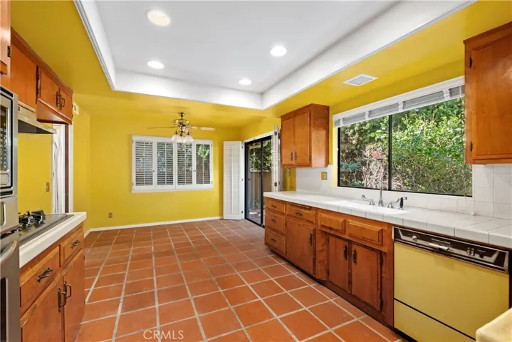 Kitchen with eating area and access to backyard