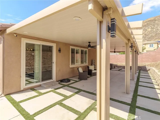 Backyard with covered patio.