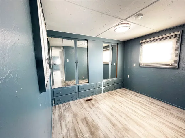 Bedroom with closets closed