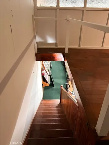 Interior stairway connecting main level and upper area.