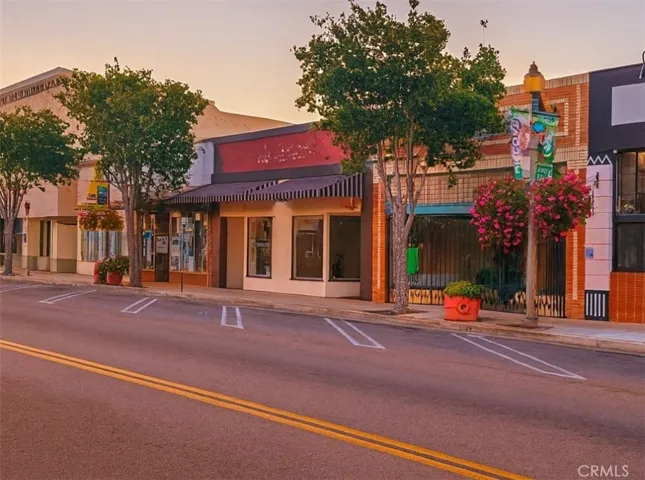 View of Main Street and Adjacent Storefronts
Westward streetscape view along Main Street highlighting 938 E Main Street and neighboring buildings for location context. Other buildings shown are not part of the listed property.