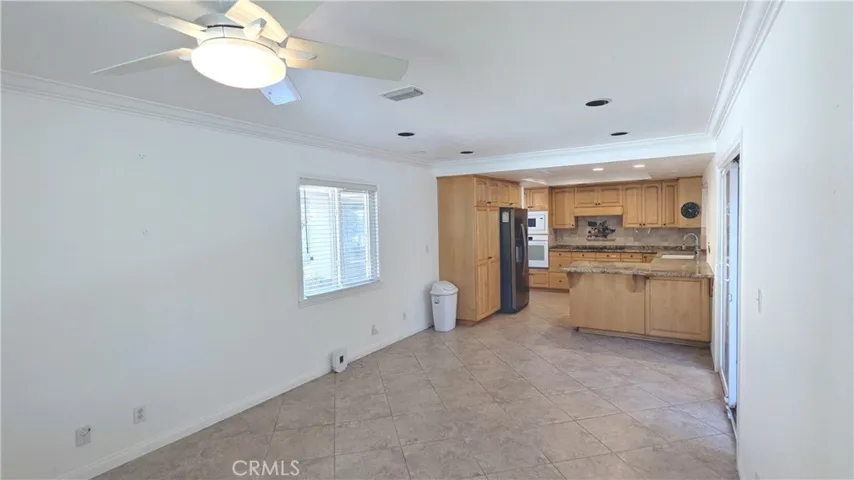 Far end of bonus area looking at kitchen