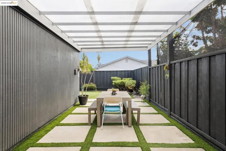 View of covered patio featuring outdoor dining area