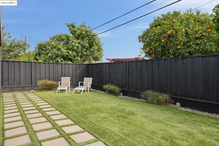 Fenced backyard with a patio