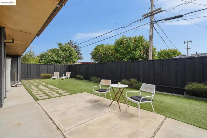 Fenced backyard featuring a patio