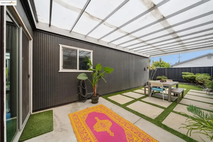 View of covered patio featuring outdoor dining area