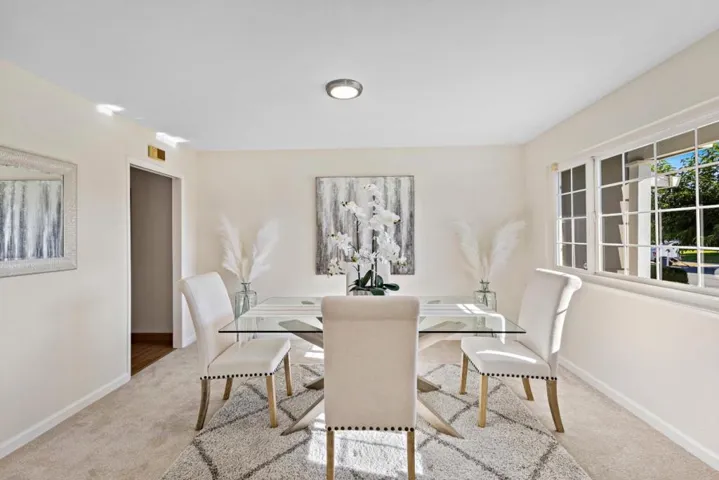 to the right of the front door is a formal dining room w a pass through to the kitchen/family room