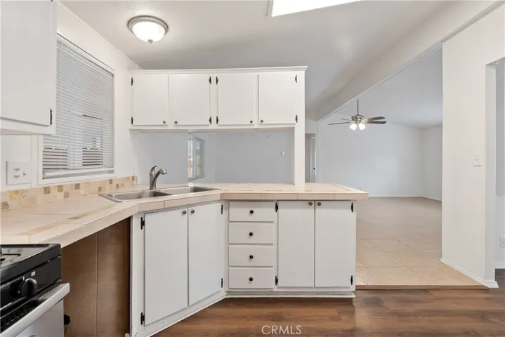 The well appointed kitchen has ample cabinets for plenty of storage.