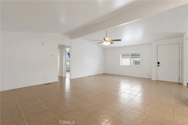 The spacious living room offers tile floors and room to spread out.