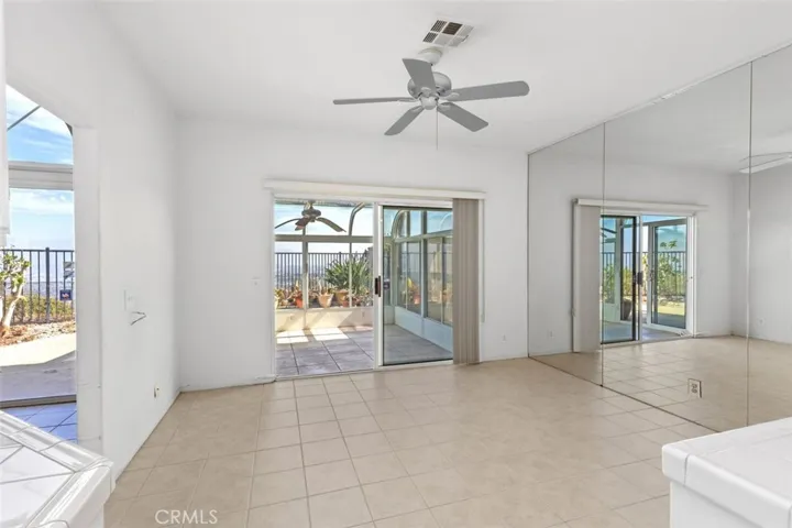 There is a sliding door off the family room. It opens to an attached greenhouse or solarium.