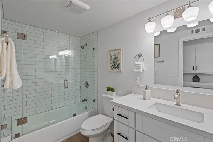 This hall bathroom has the second tub in the house