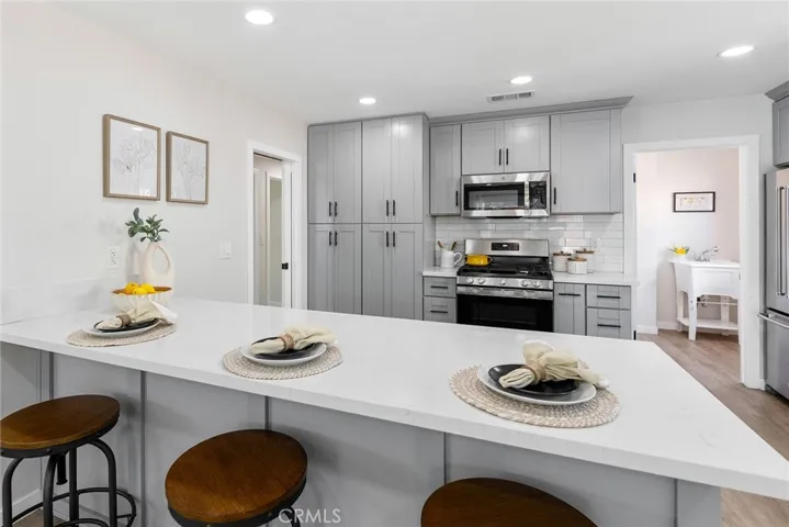 The quartz peninsula is perfect for guests to hand out or kids to do homework on