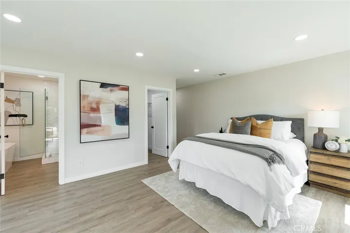 A beautifully remodeled bathroom and walk in closet