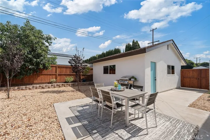 The detached 2-car garage has a back door to the backyard
