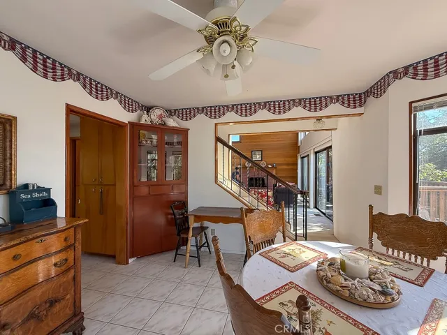 Dining Room looking into Living Area and stairs to Primary Bedroom Loft