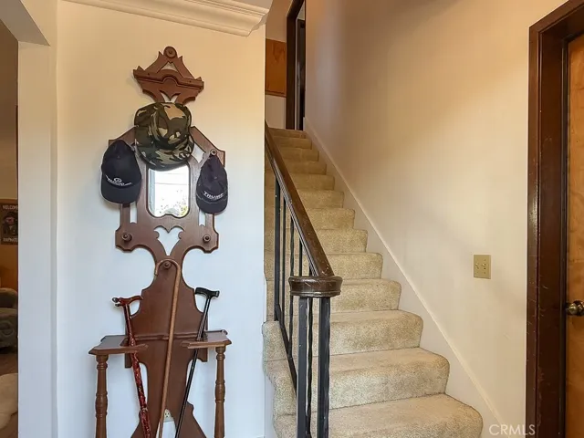 Stairs up to Main Living Area. Garage door to the right