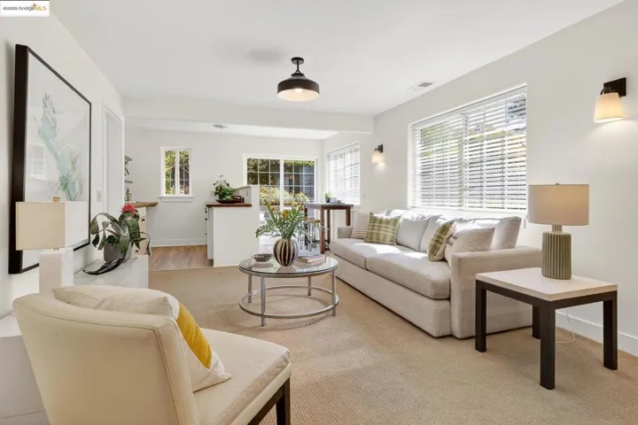 Lower level sitting room or media room, looking to wet bar area and sliding doors to the yard