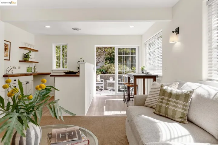 Lower level living room/media room, with wet bar and sliding doors to garden