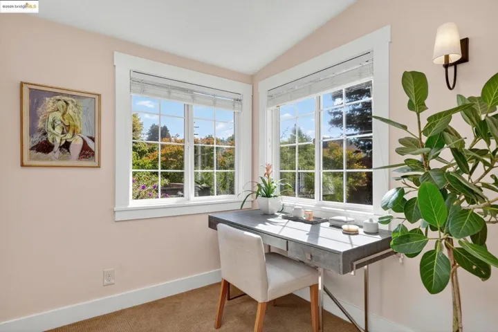 Off main level primary bedroom, an additional dressing room/office with skylight